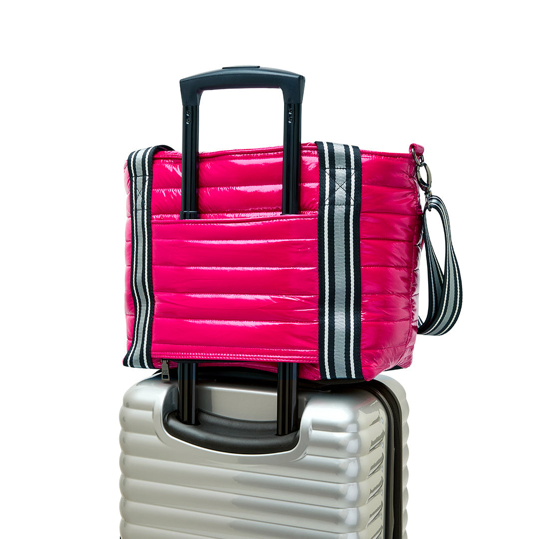 Think Royln Ace of the Court pickleball bag in sleek black patent material with multiple compartments for sports gear.