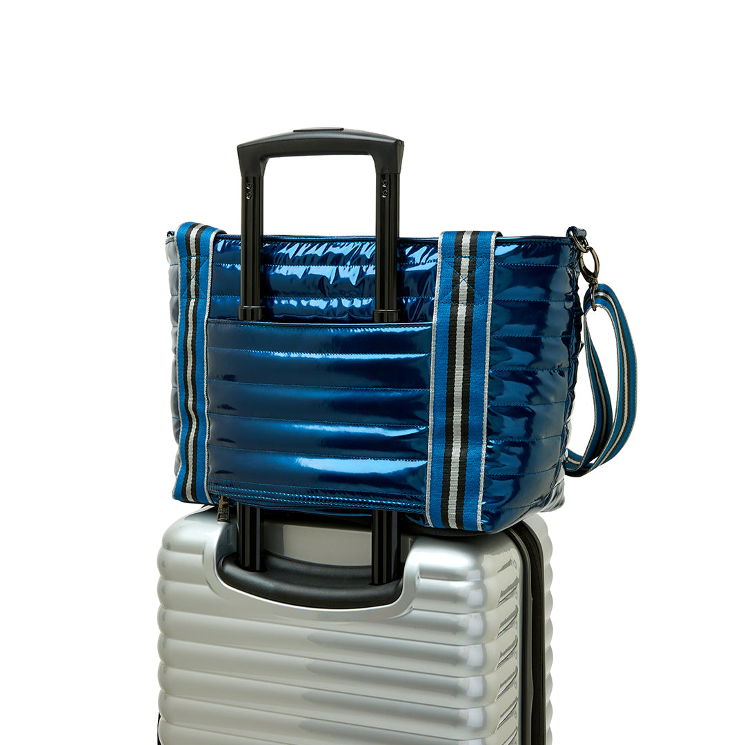 Think Royln Ace of the Court pickleball bag in sleek black patent finish with multiple compartments and stylish design.