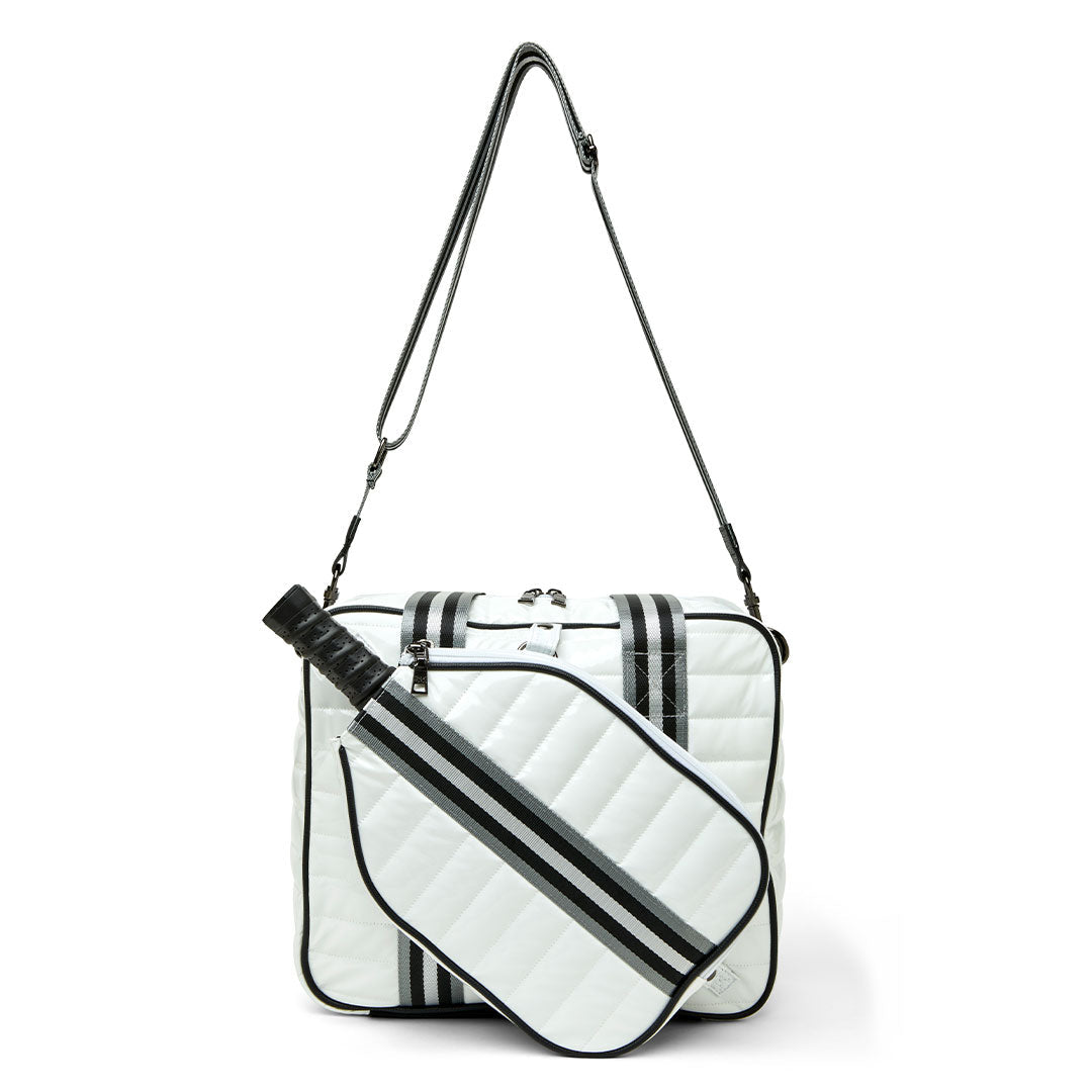 White patent Think Royln Sporty Spice pickleball bag with multiple compartments and sporty design for carrying pickleball gear.