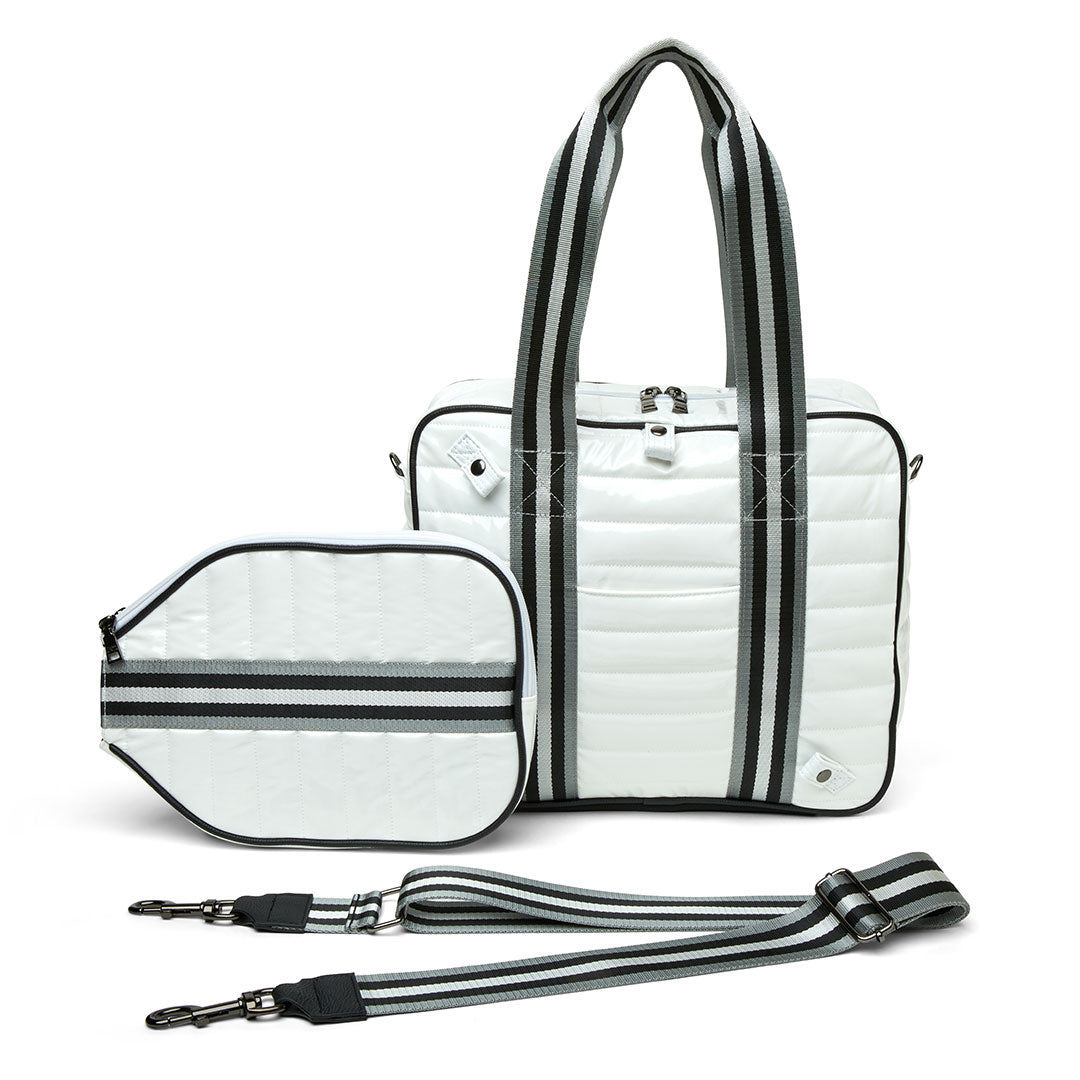 White patent Think Royln Sporty Spice pickleball bag with multiple compartments and sporty design for carrying pickleball gear.