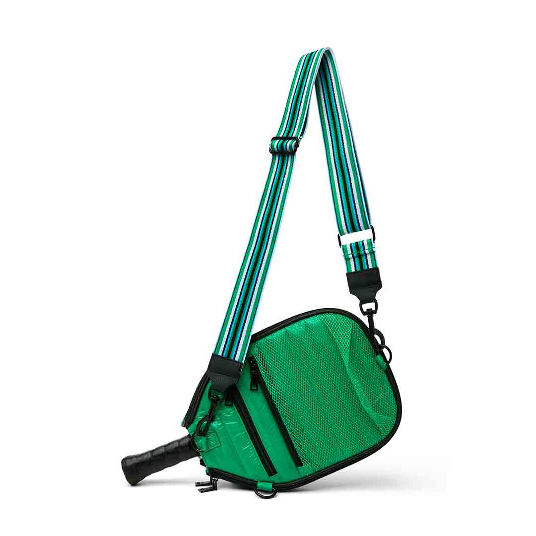 Think Royln Sporty Spice pickleball bag in white patent with sporty design and multiple compartments for accessories.