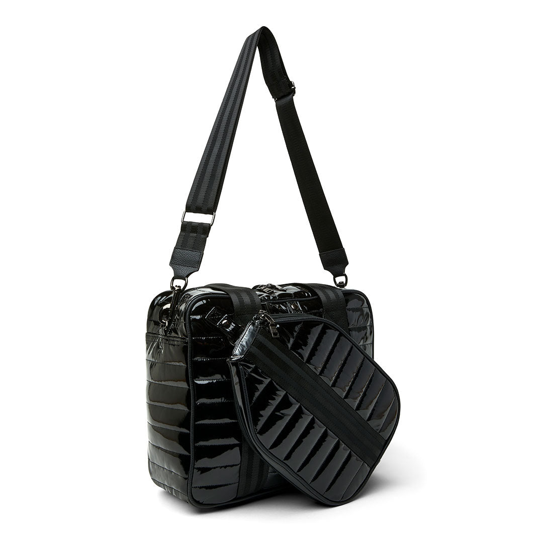 Think Royln Sporty Spice pickleball bag in white patent with sporty design and multiple compartments for accessories and paddles.