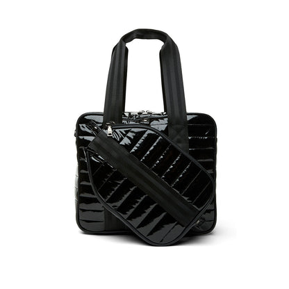 Think Royln Sporty Spice pickleball bag in white patent leather with sporty design and multiple compartments for accessories.