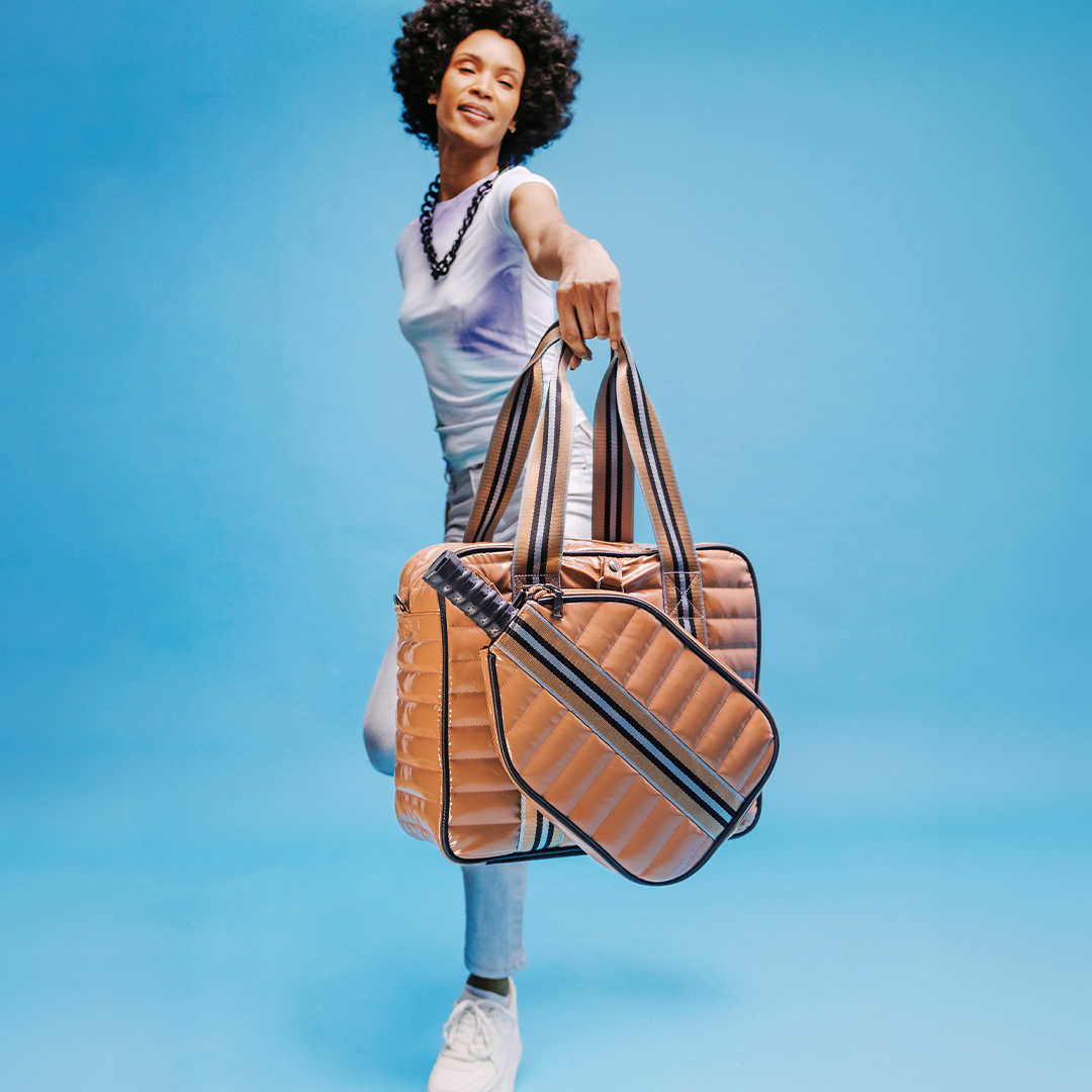 White patent Think Royln Sporty Spice pickleball bag with multiple compartments and sporty design.