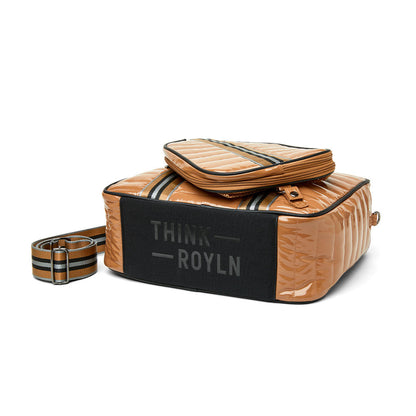 Think Royln Sporty Spice pickleball bag in white patent material, stylish and spacious for sports gear storage.