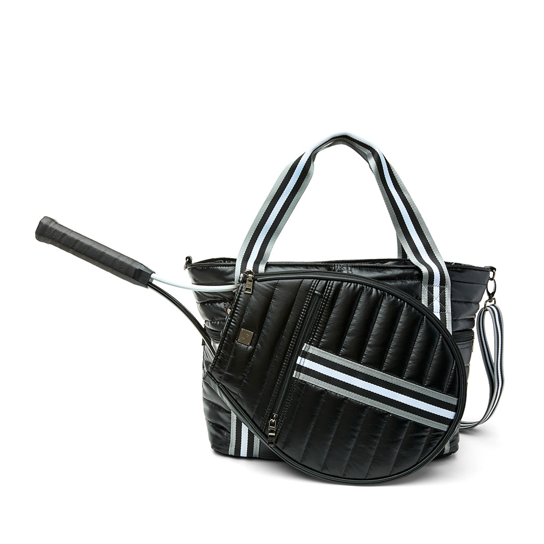 Black patent Love Royln tennis bag by Think Royln with sleek design and spacious compartments for sports gear and accessories.