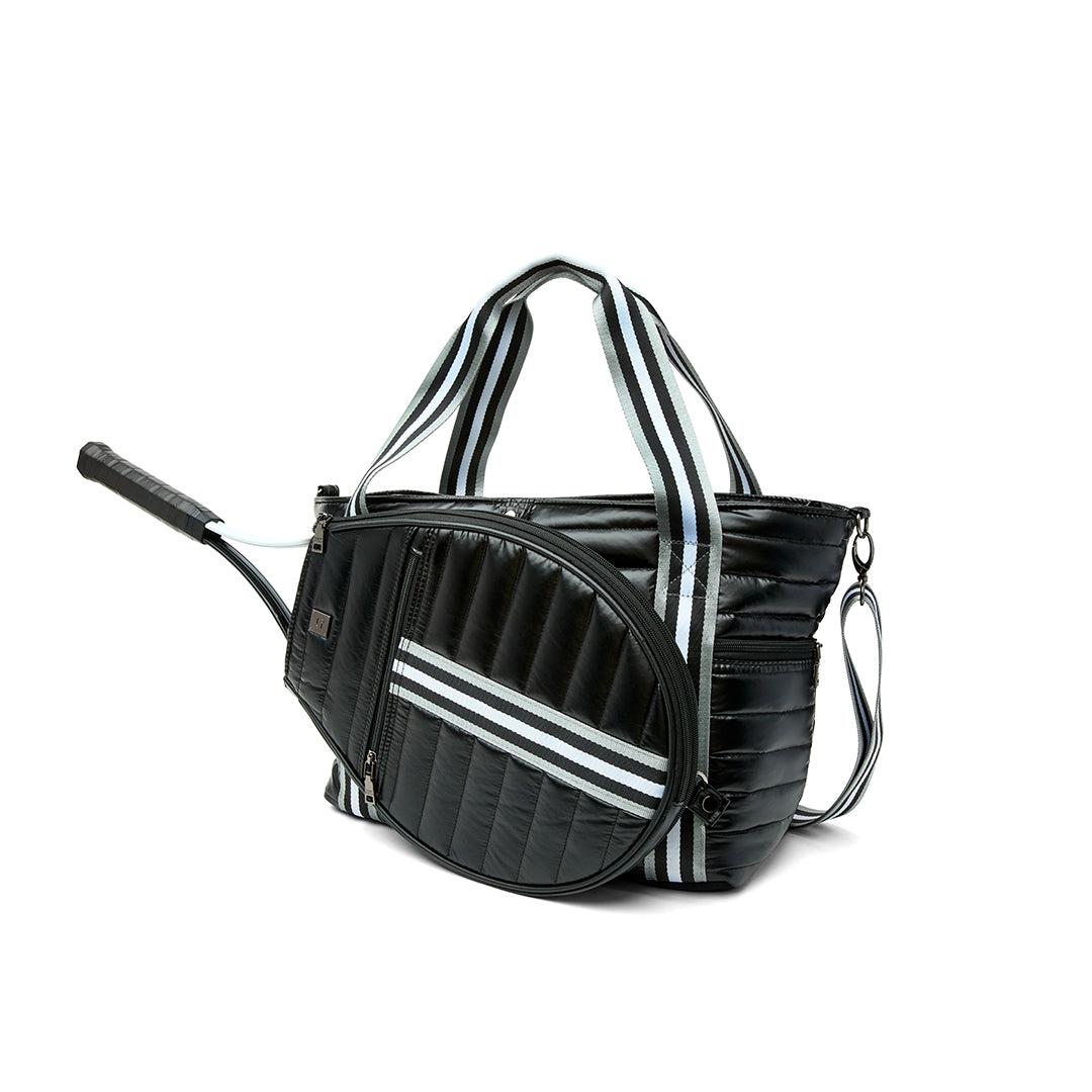 Black patent Love Royln tennis bag by Think Royln featuring a sleek design, spacious compartments, and stylish handles.