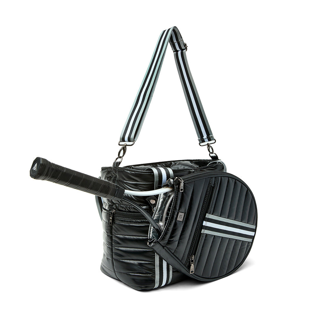 Black patent Love Royln tennis bag by Think Royln with sleek design and spacious compartments, perfect for sports and casual use.