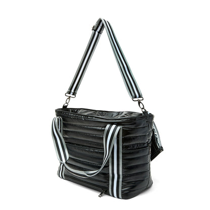 Black patent Love Royln tennis bag by Think Royln with sleek design and spacious interior for carrying tennis essentials.