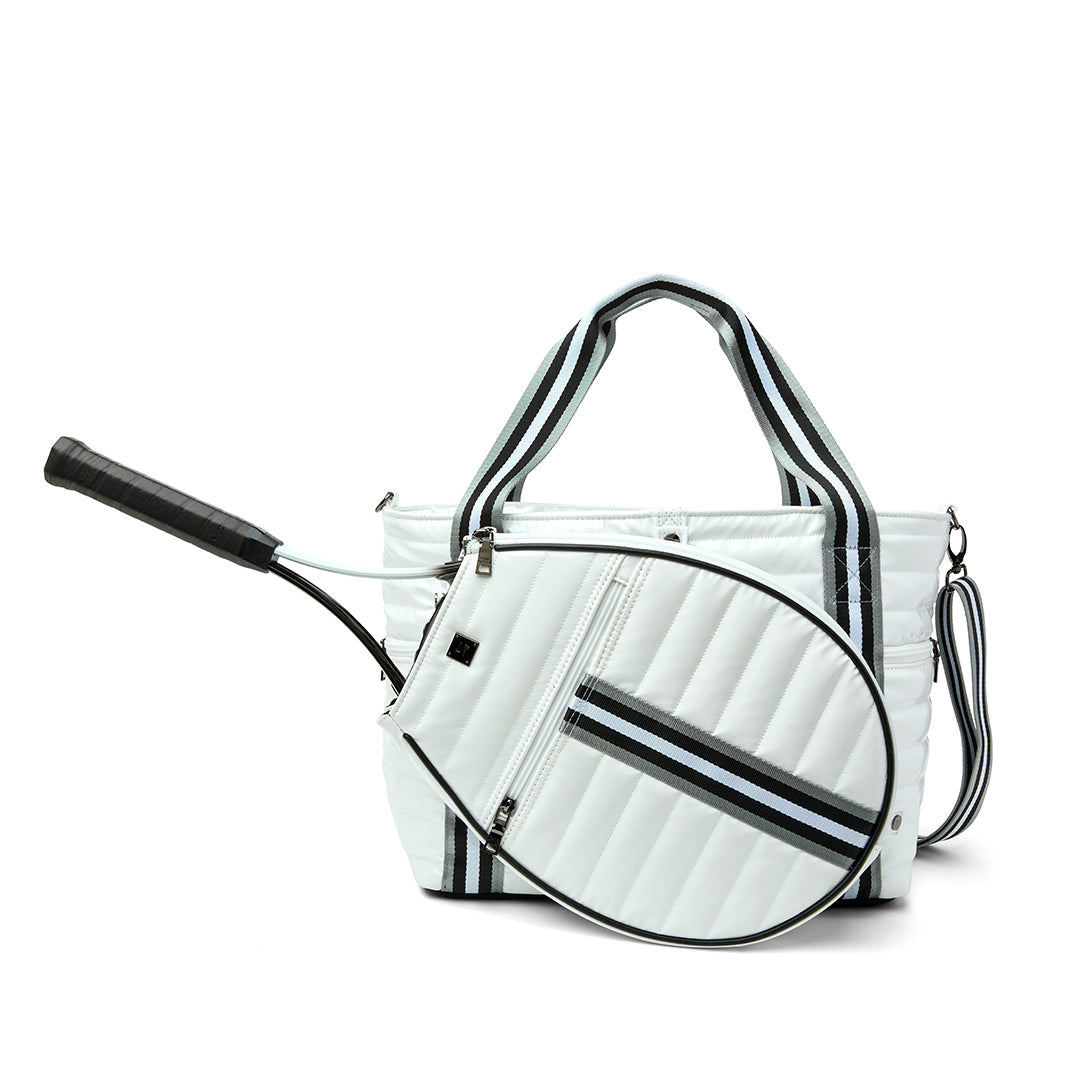 Black patent Love Royln tennis bag by Think Royln with sleek design and spacious interior for tennis accessories.