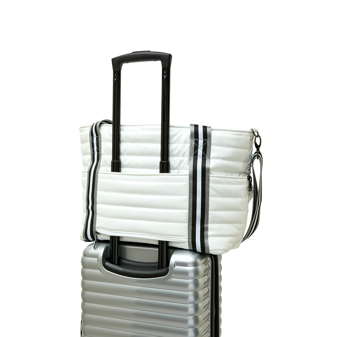 Black patent Love Royln tennis bag by Think Royln featuring sleek design and spacious storage for tennis accessories.