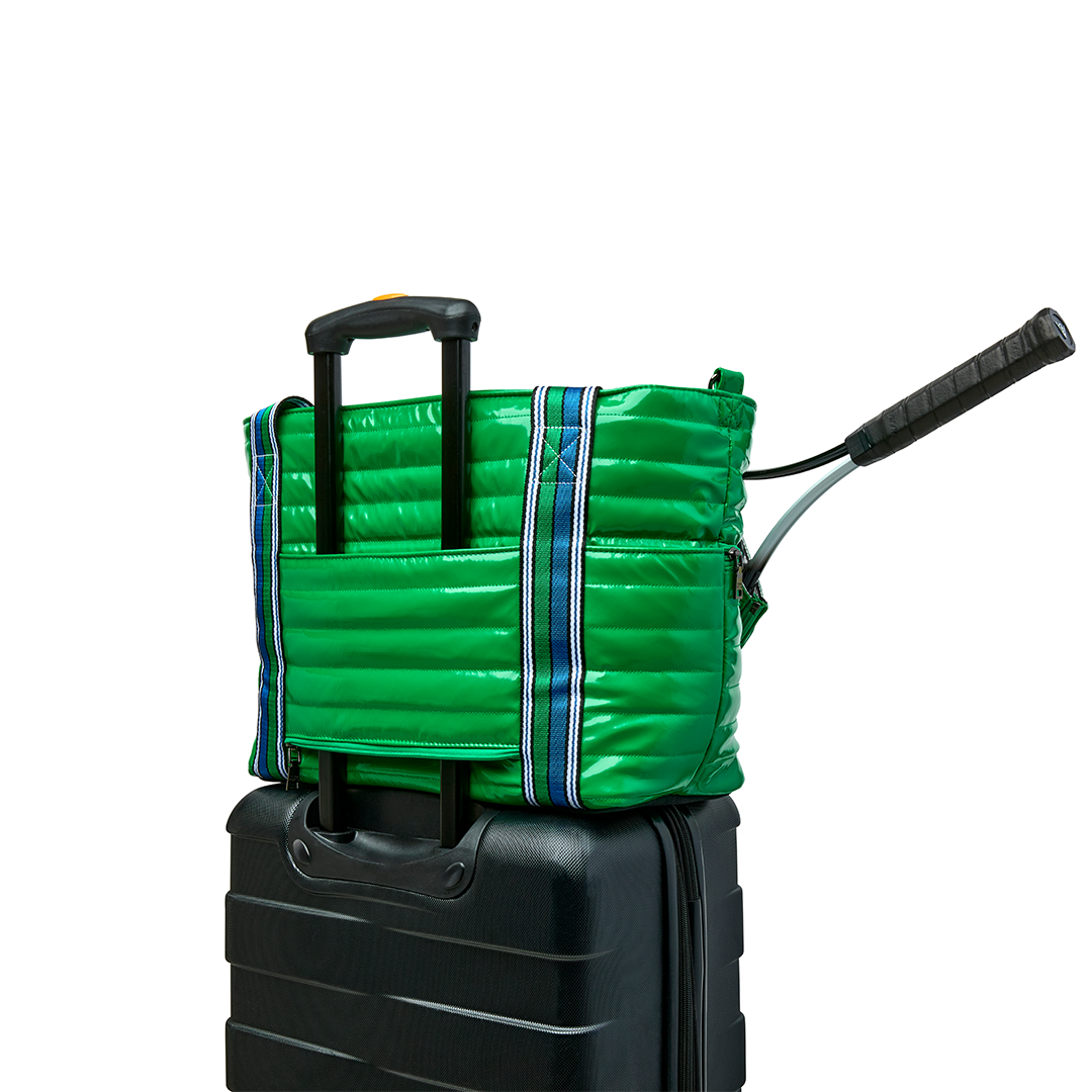 Black patent Love Royln tennis bag by Think Royln with dual handles and spacious interior for tennis gear and accessories.