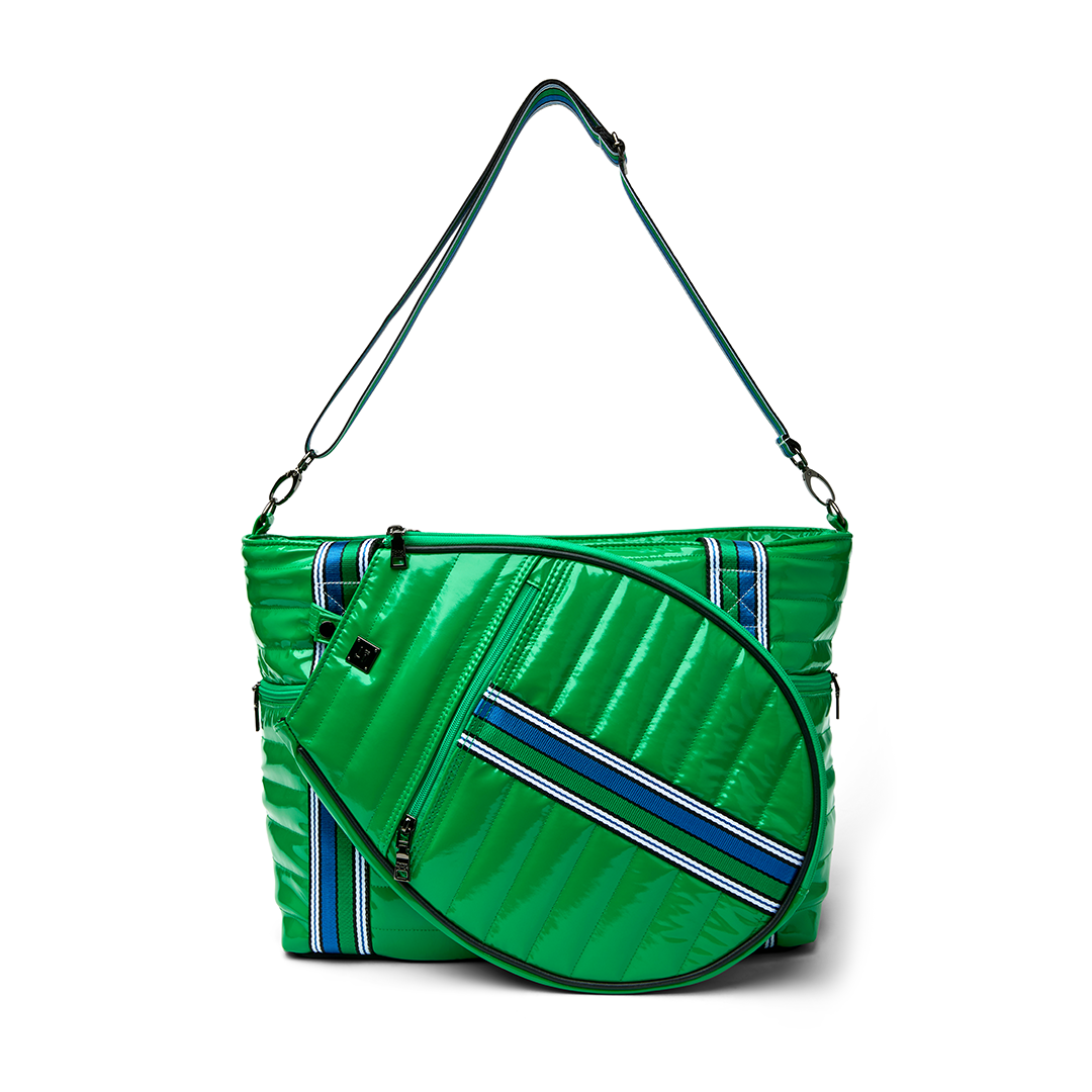Black patent Love Royln tennis bag by Think Royln featuring sleek design and spacious compartments for tennis gear.