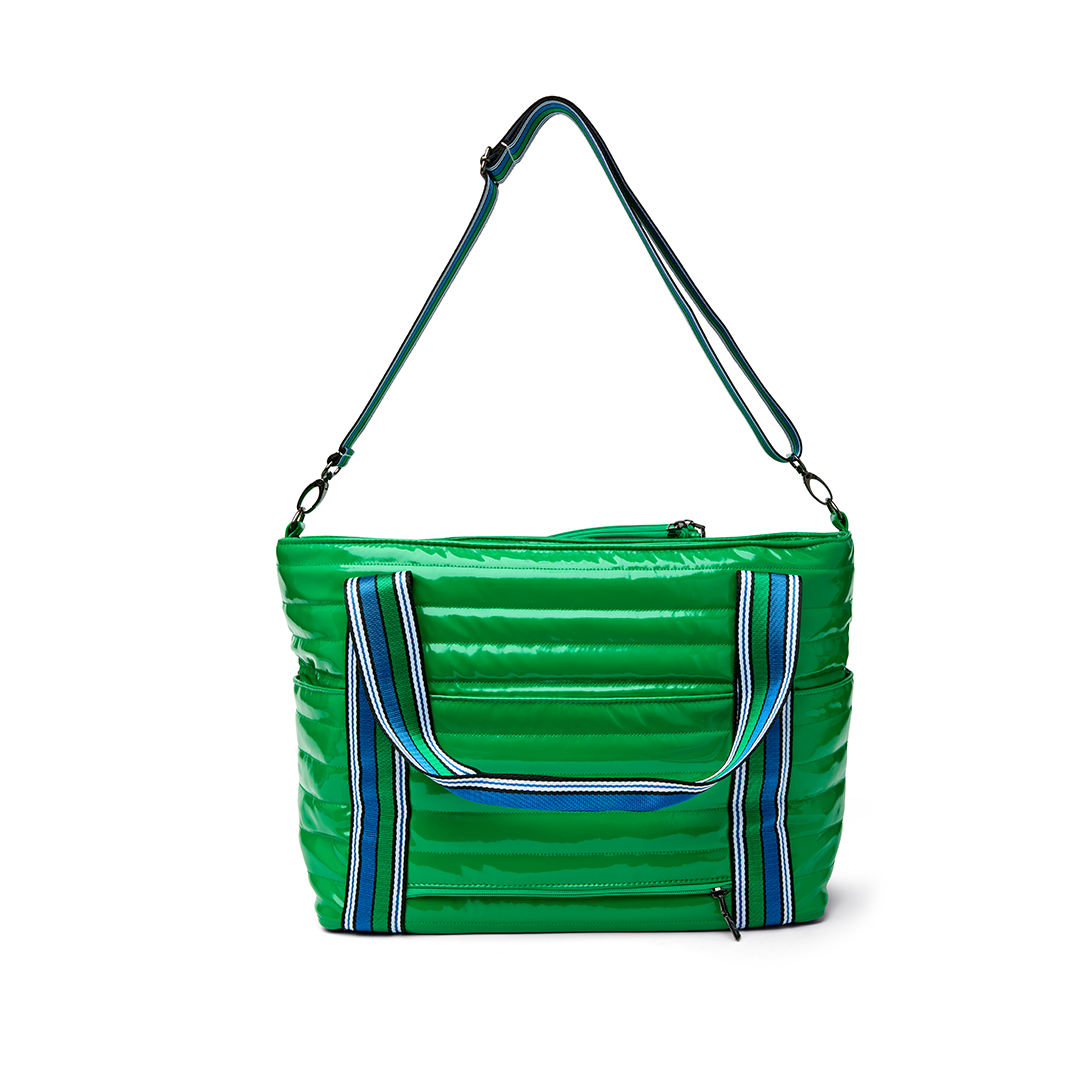 Black patent Love Royln Tennis Bag by Think Royln with sleek design and spacious compartments for tennis accessories.