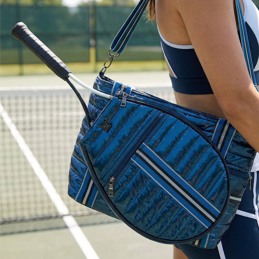 Black patent Love Royln tennis bag by Think Royln with sleek design and multiple compartments, ideal for carrying tennis gear.