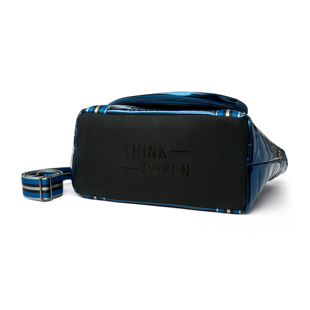 Black patent Love Royln tennis bag by Think Royln with sleek design and multiple compartments for sports and casual use.