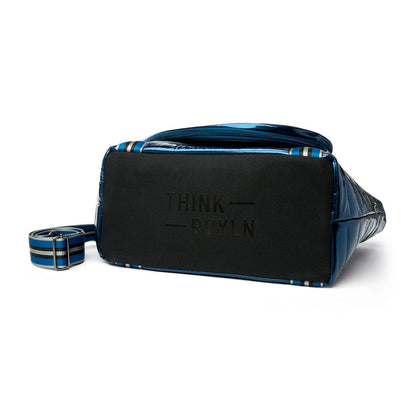 Black patent Love Royln tennis bag by Think Royln with sleek design and multiple compartments for sports and casual use.