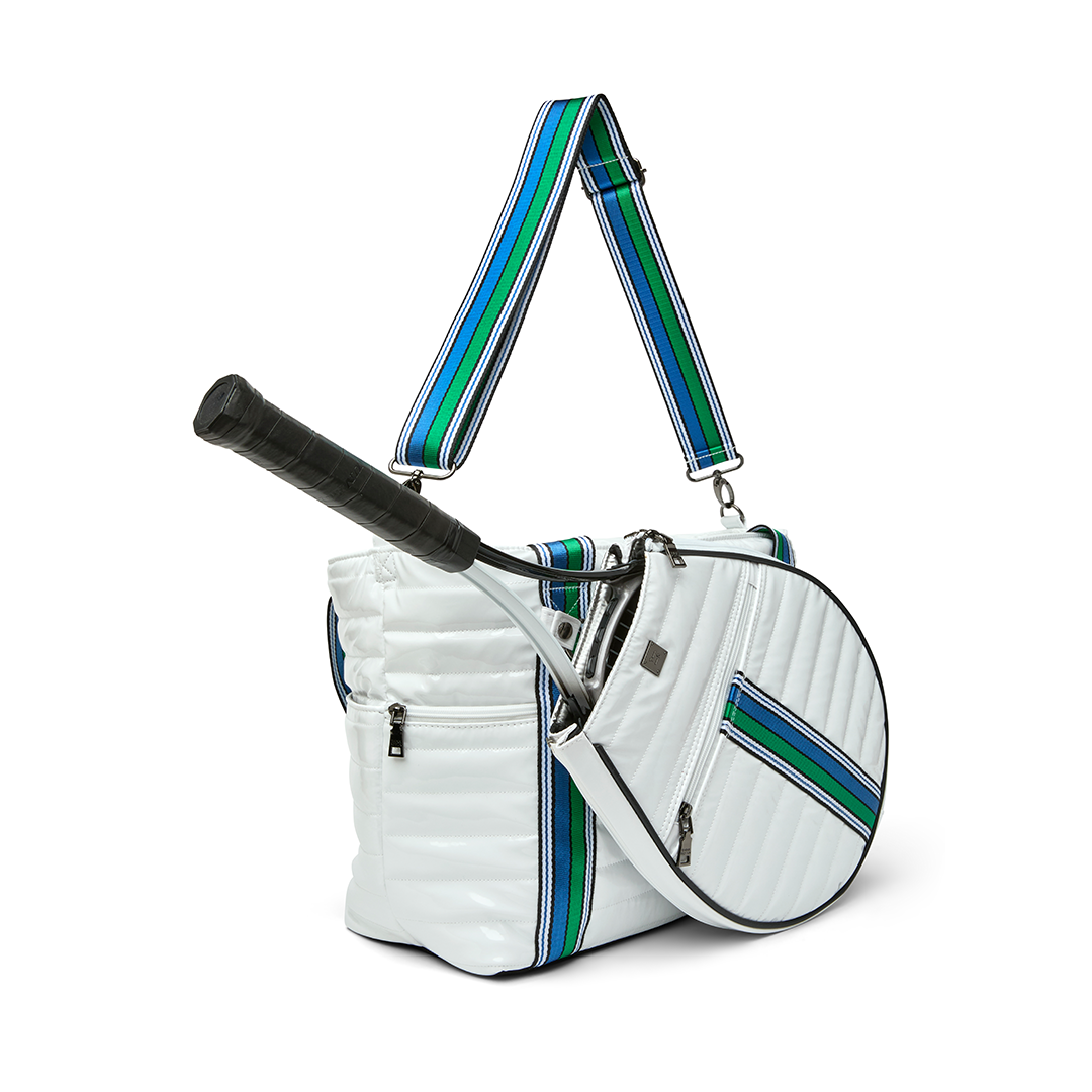 Black patent Love Royln tennis bag by Think Royln with sleek design, multiple compartments, and stylish handles.