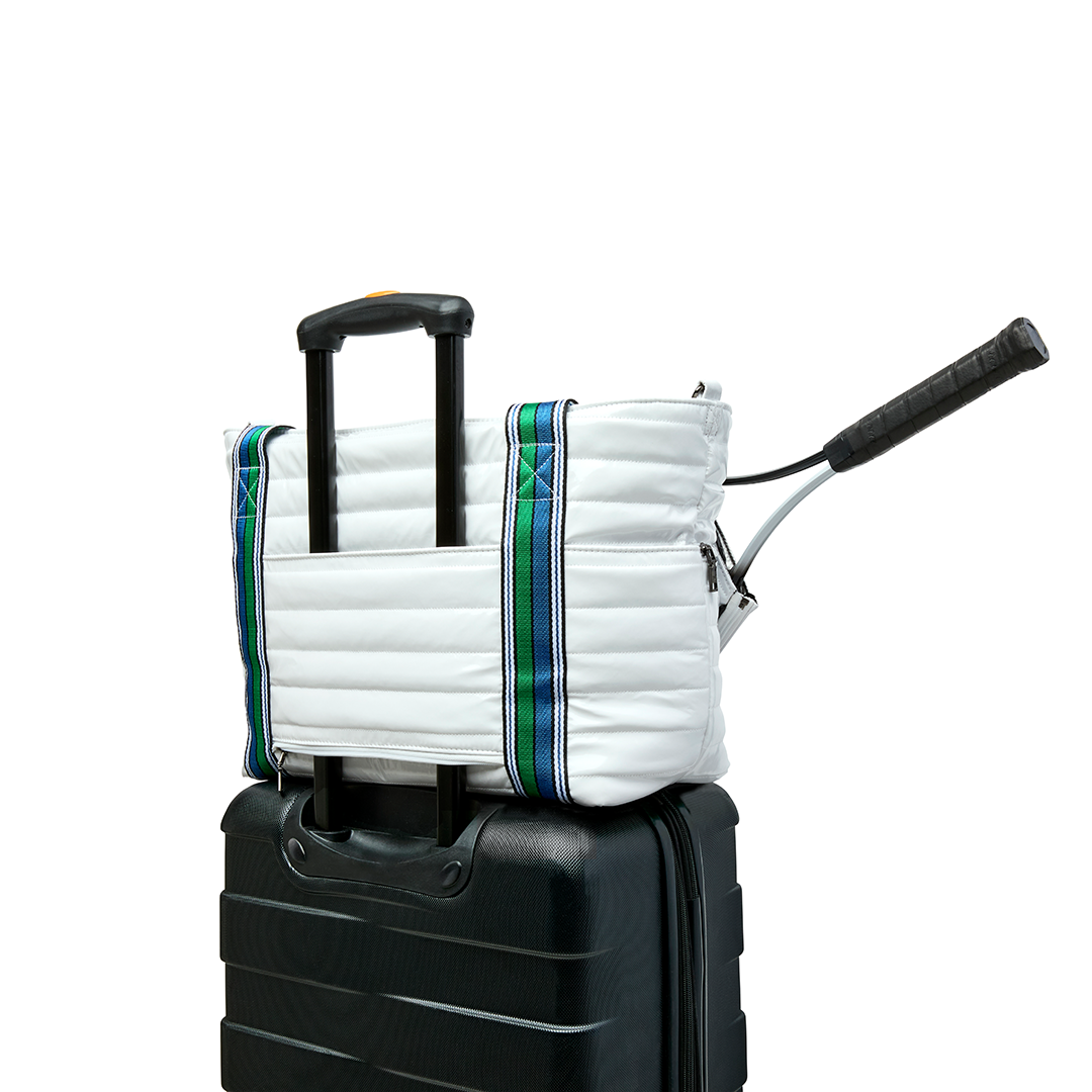 Black patent Love Royln tennis bag by Think Royln with sleek design and spacious compartments for sports and casual use.