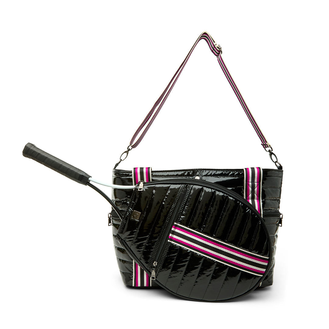 Black patent Love Royln tennis bag by Think Royln with sleek design and spacious compartments.