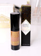 Kismet natural tinted moisturizer with hyaluronic acid, showcasing a dark tinted shade in a sleek tube.