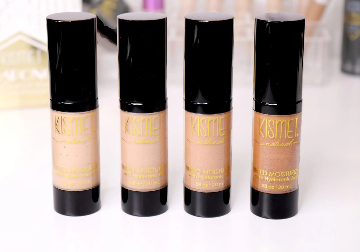 Kismet natural tinted moisturizer with hyaluronic acid, showing a smooth, lightly tinted cream in a sleek packaging.