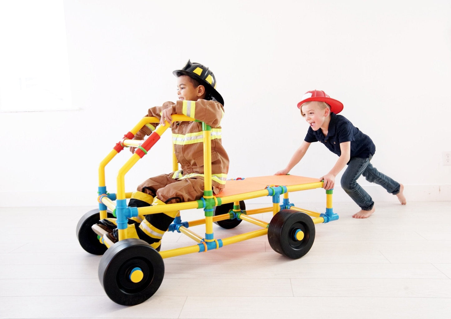 Two TubeLox Deluxe STEM toy sets featuring colorful plastic tubes and connectors for creative building and educational play.