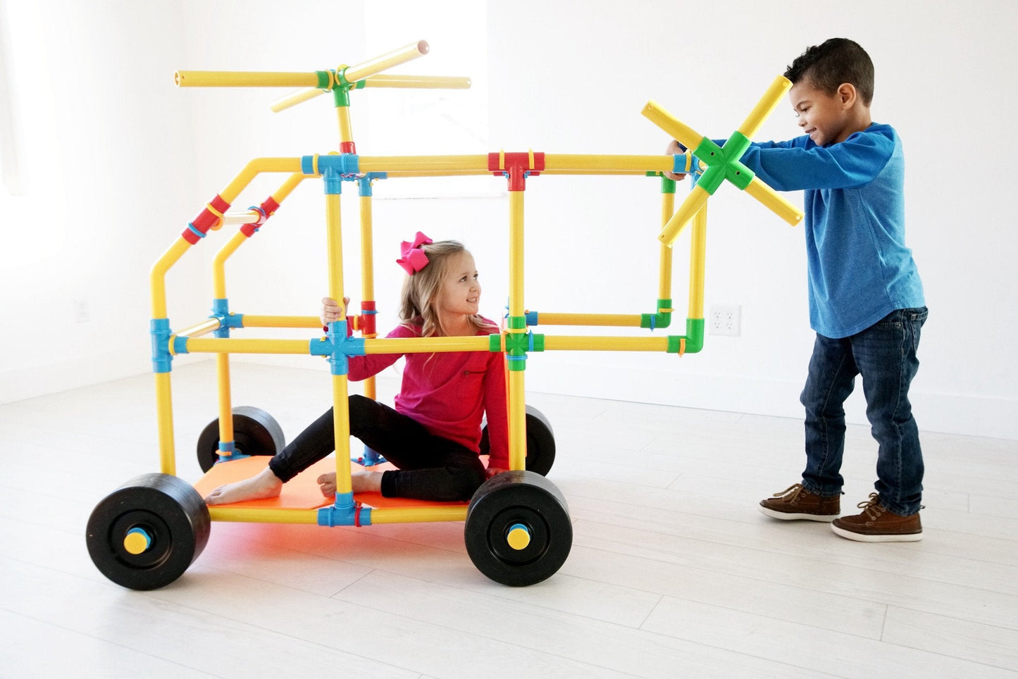 Two TubeLox Deluxe STEM toy sets with colorful tubes and connectors for creative building and engineering fun.