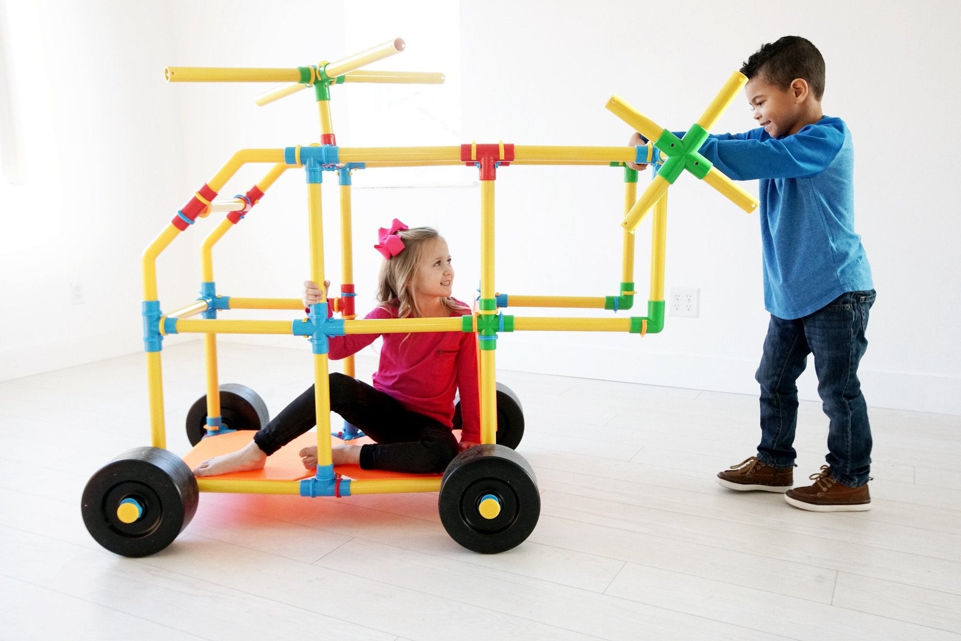 Two TubeLox Deluxe STEM toy sets with colorful tubes and connectors for creative building and engineering fun.