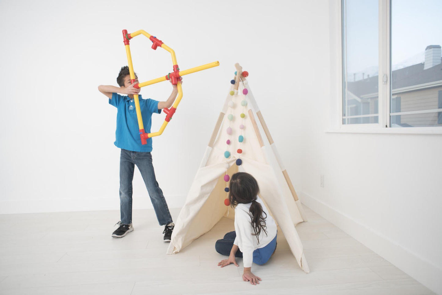 Two TubeLox Deluxe STEM toy sets with colorful tubes and connectors in primary colors, perfect for creative building and learning.