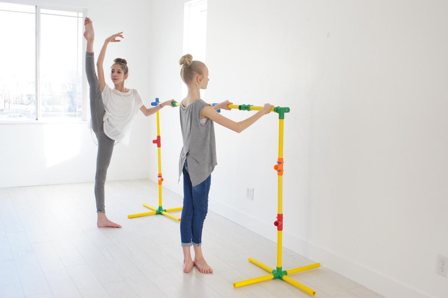 Two TubeLox Deluxe STEM toy sets in primary colors with interconnected tubes and connectors, designed for creative building fun.