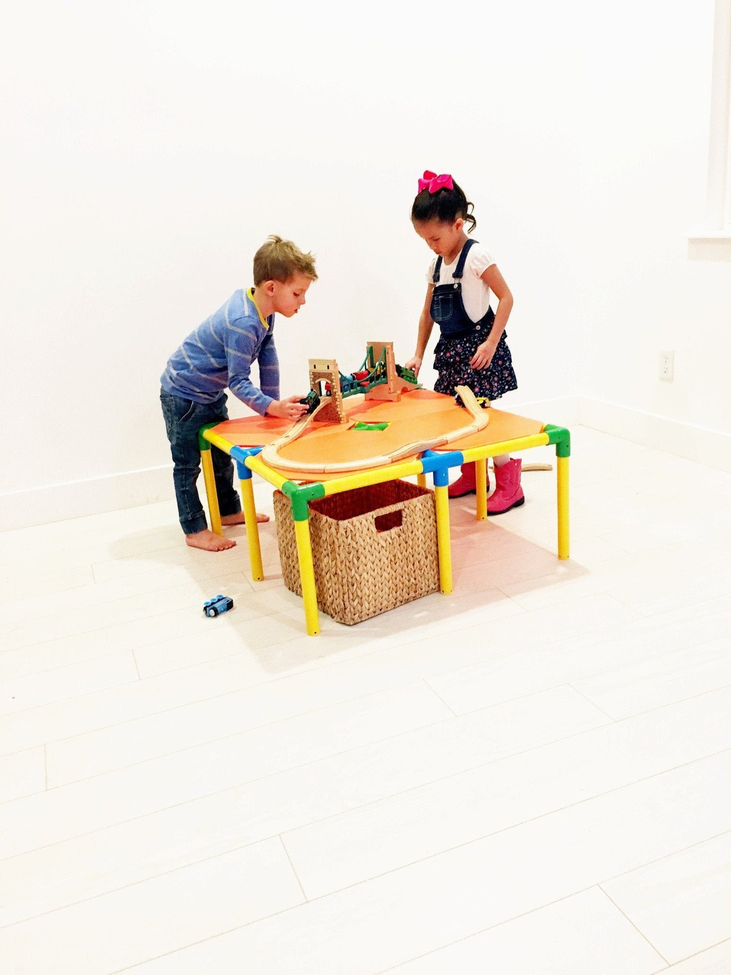 Two TubeLox Deluxe STEM toy sets with colorful plastic tubes and connectors for creative building and engineering play.
