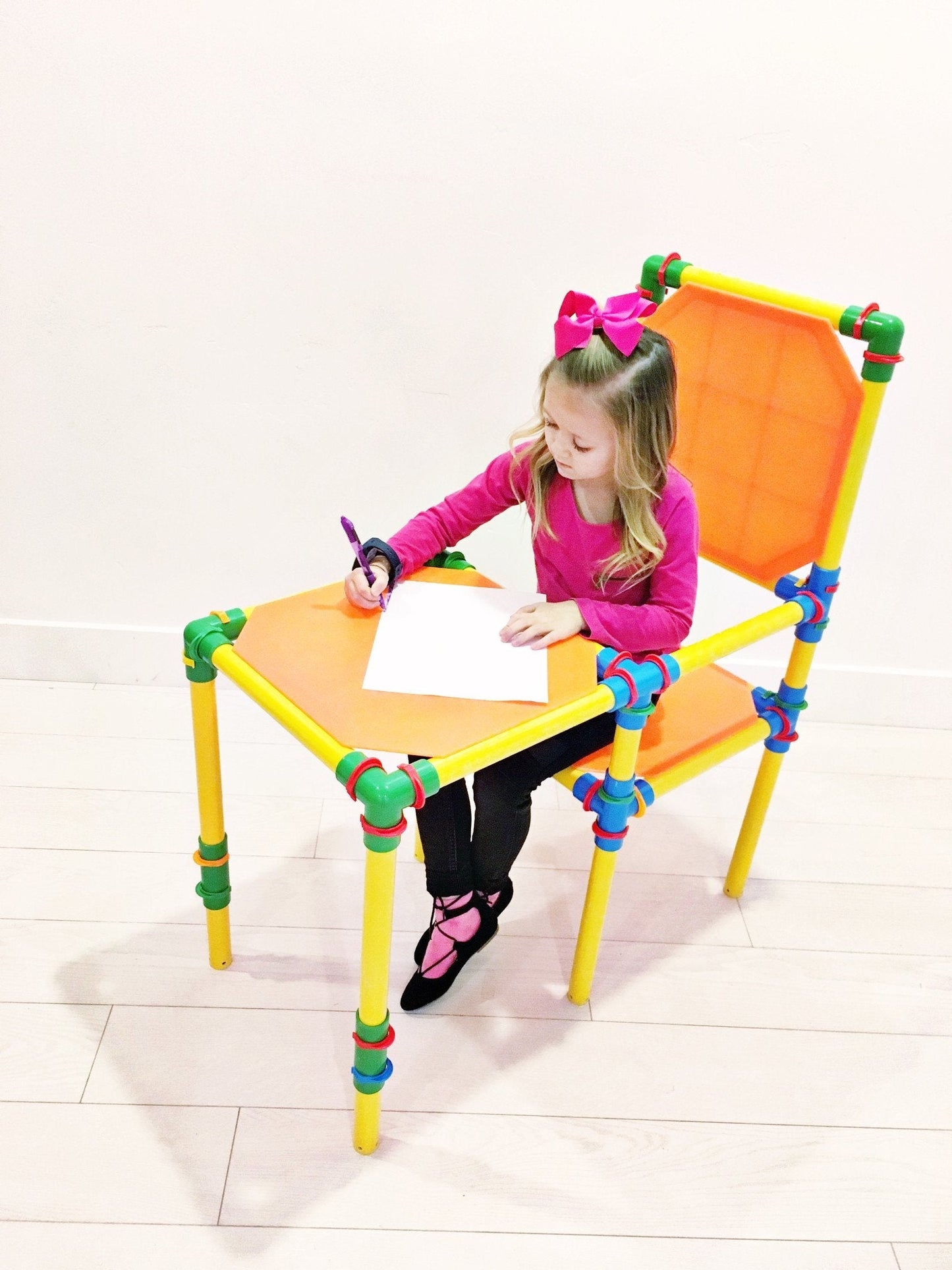 Two TubeLox Deluxe STEM toy sets with colorful tubes and connectors for creative building and educational play.
