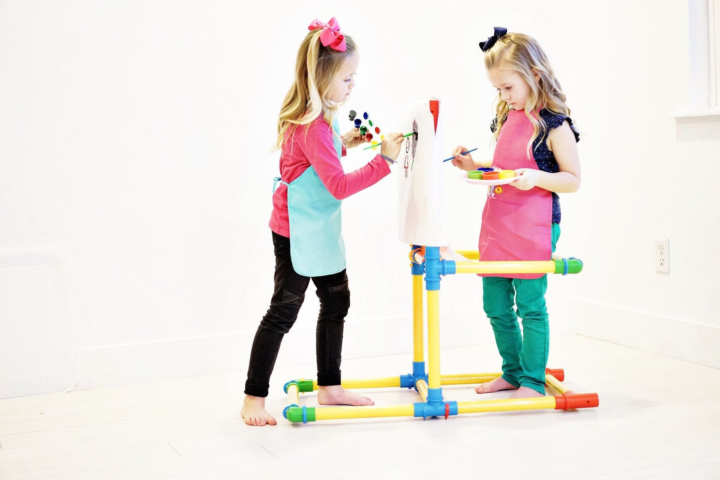 Two TubeLox Deluxe STEM toy sets with colorful tubes in primary colors, perfect for creative building and educational play.