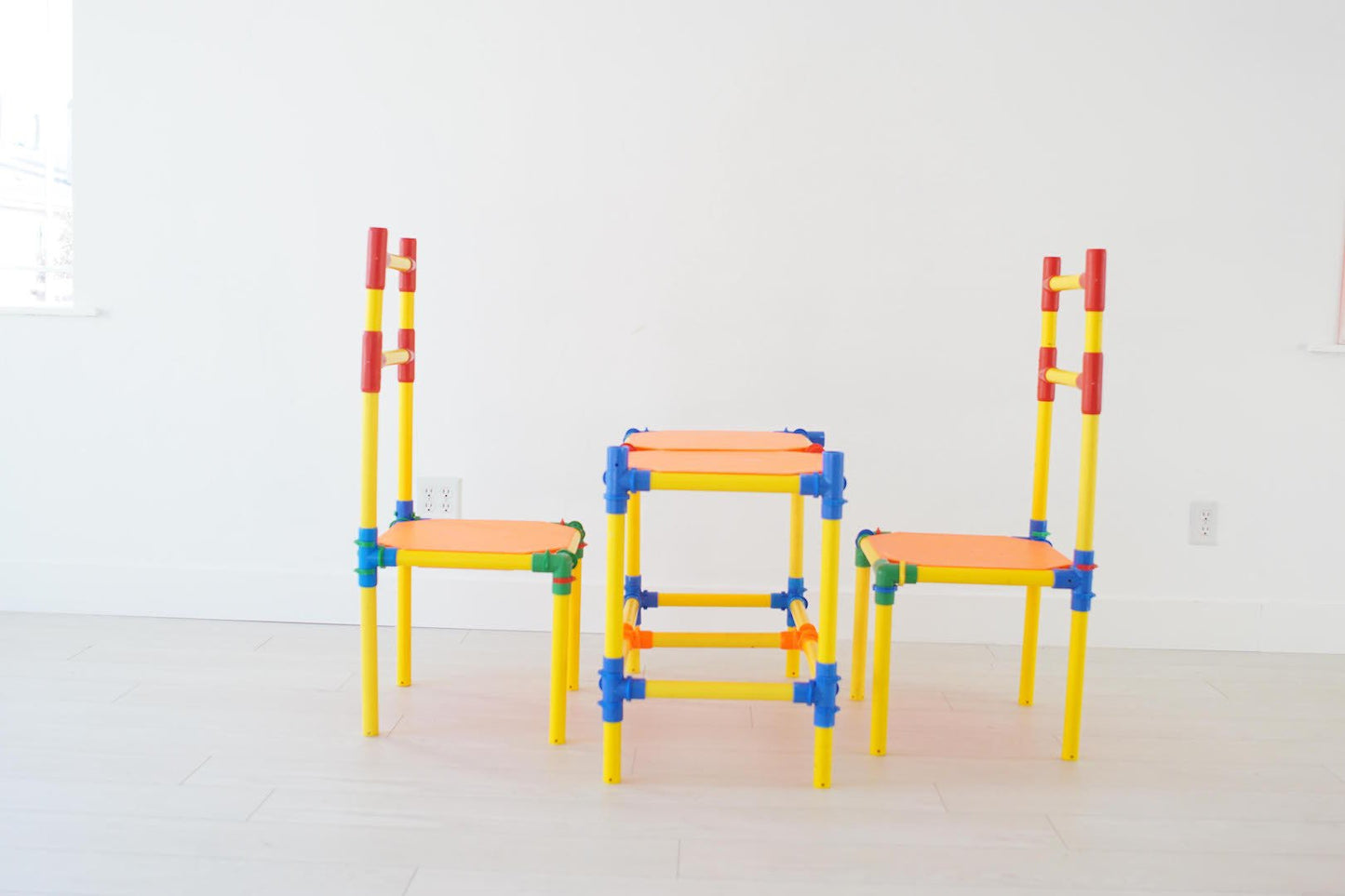 Two TubeLox Deluxe STEM toy sets with colorful tubes and connectors for creative building and educational play.