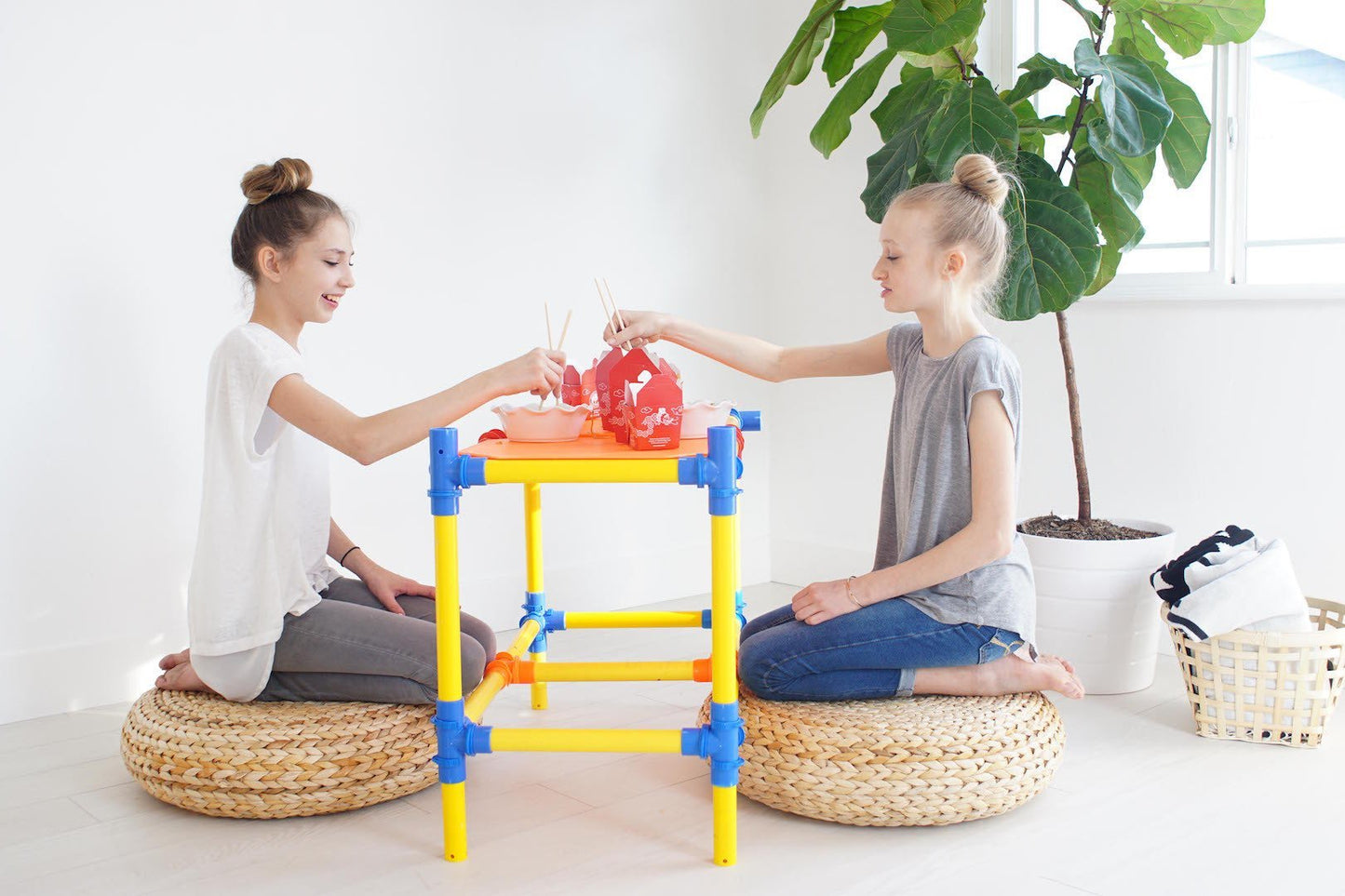 Two TubeLox Deluxe STEM Toy sets featuring colorful plastic tubes and connectors for creative building and hands-on learning.