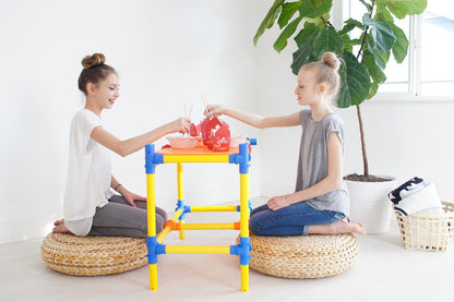 Two TubeLox Deluxe STEM Toy sets featuring colorful plastic tubes and connectors for creative building and hands-on learning.