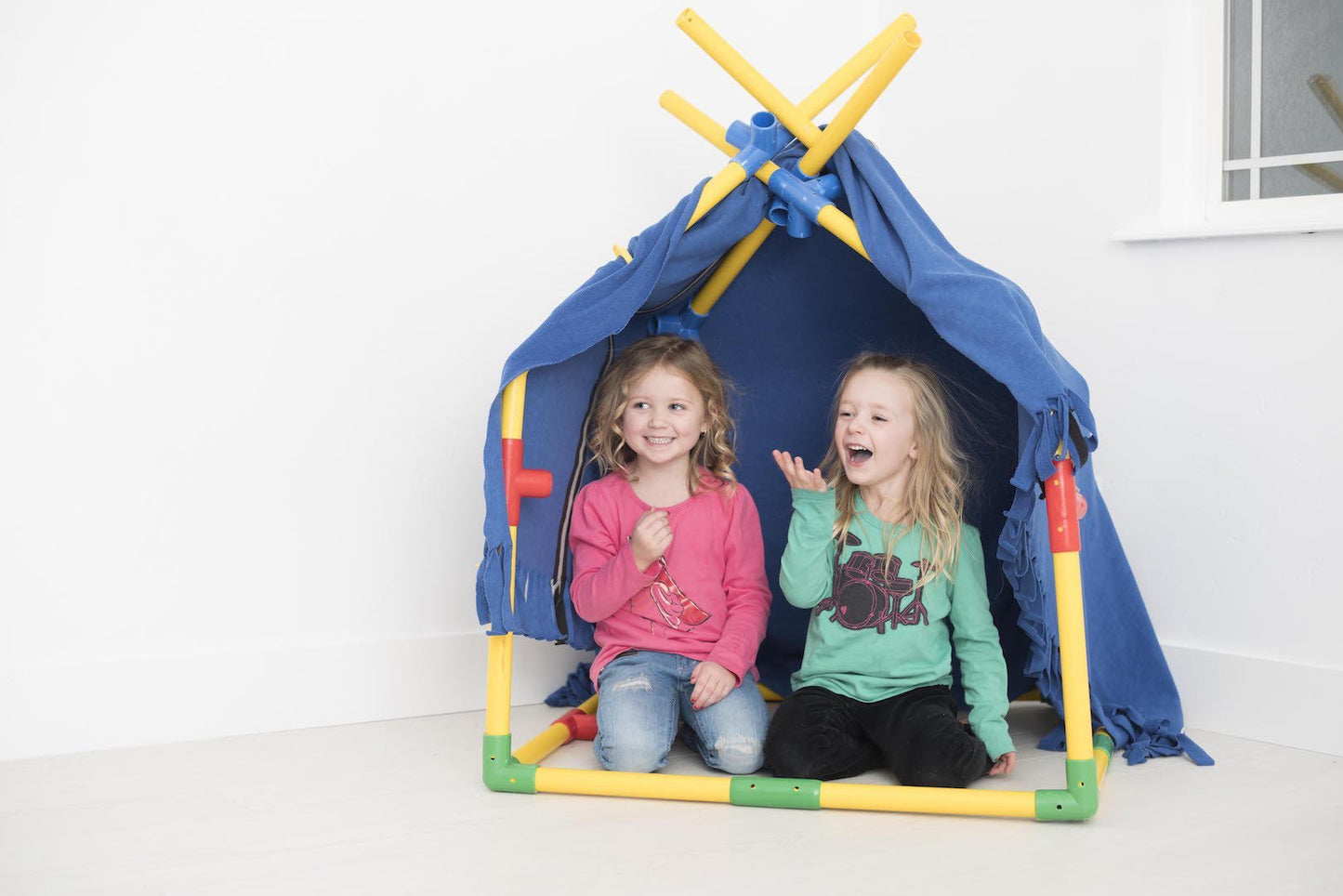 Two TubeLox Deluxe STEM toy sets in primary colors featuring colorful plastic tubes and connectors for creative building.
