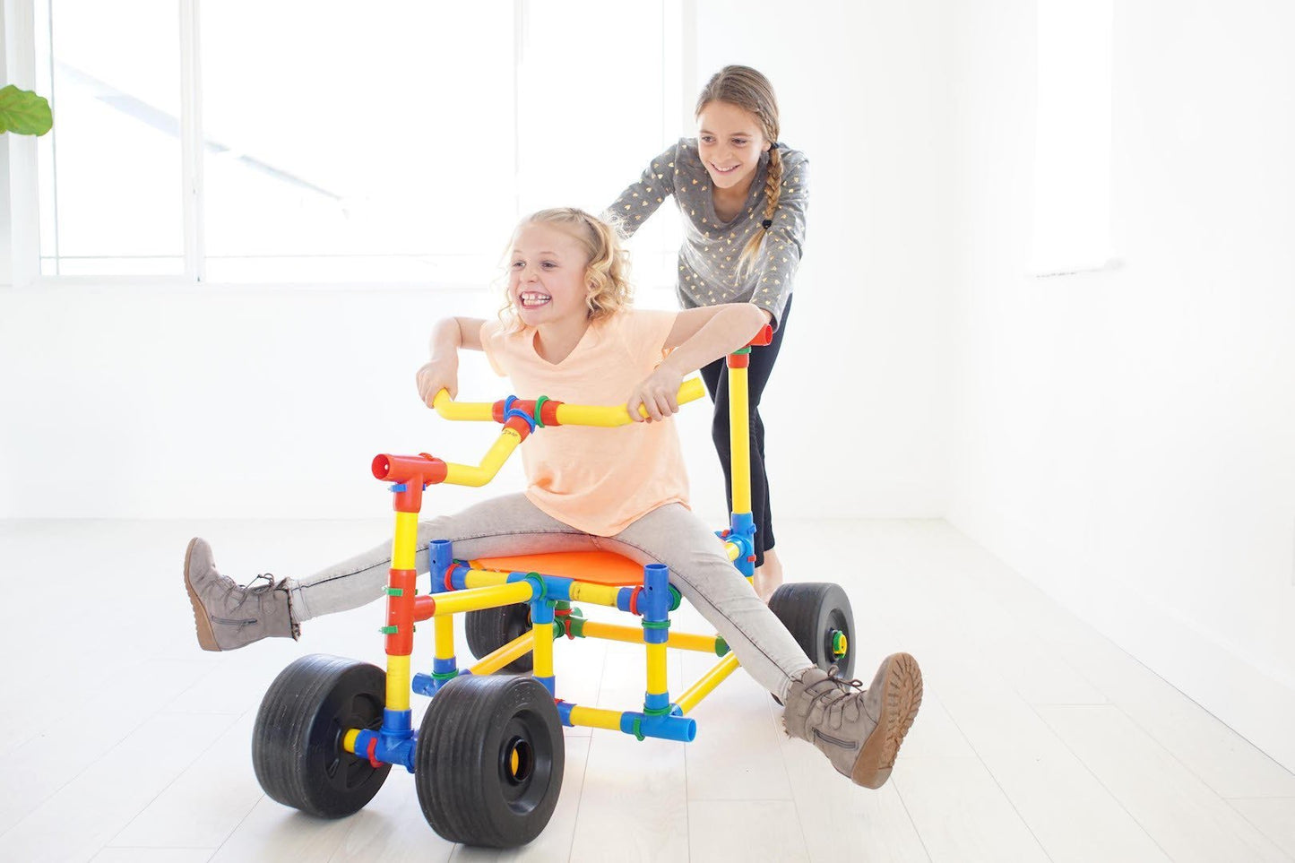 Two TubeLox Deluxe STEM Toy sets with colorful tubes and connectors for creative building and engineering activities.