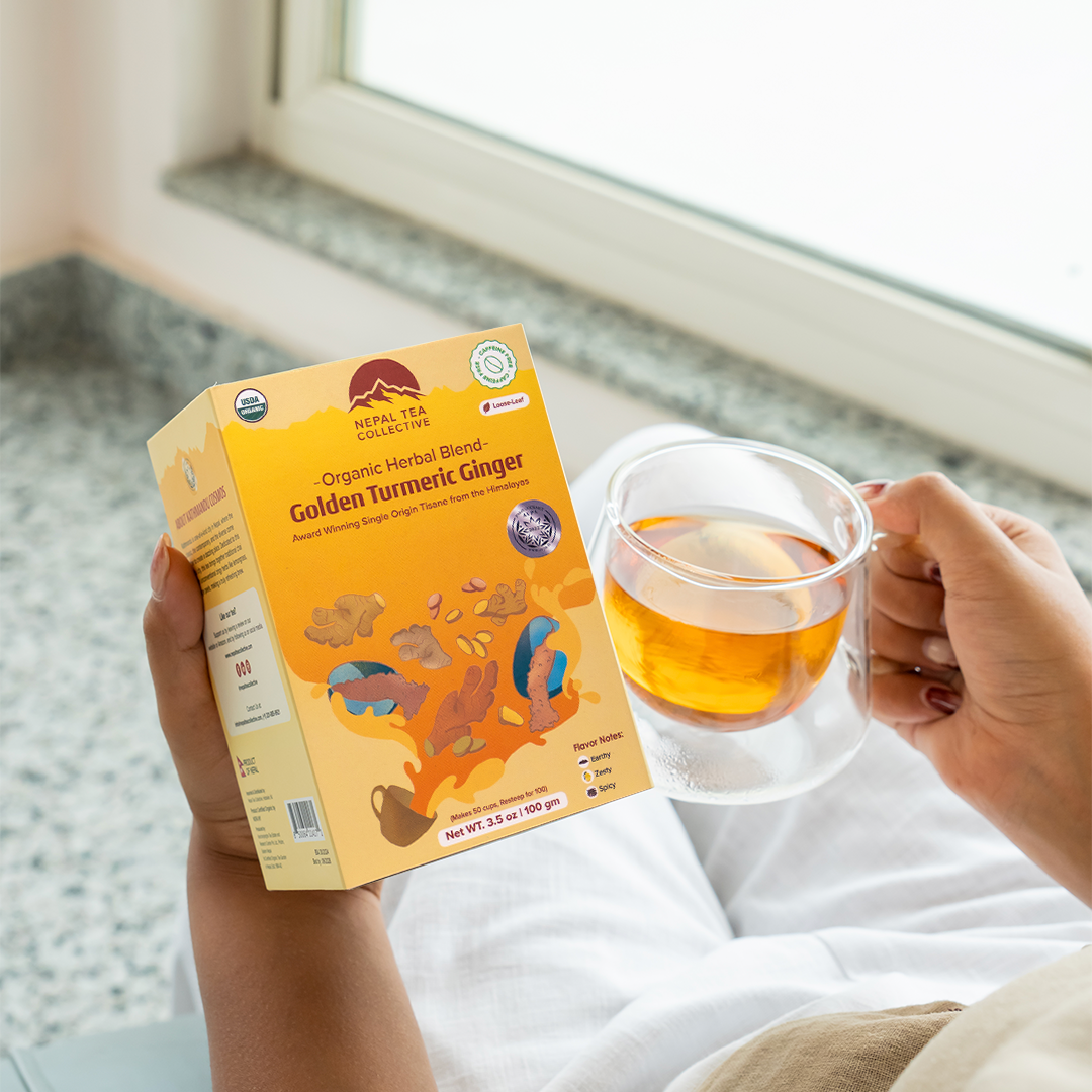Organic Golden Turmeric Ginger blend by Nepal Tea, showing a vibrant mix of turmeric and ginger ingredients in a natural setting.