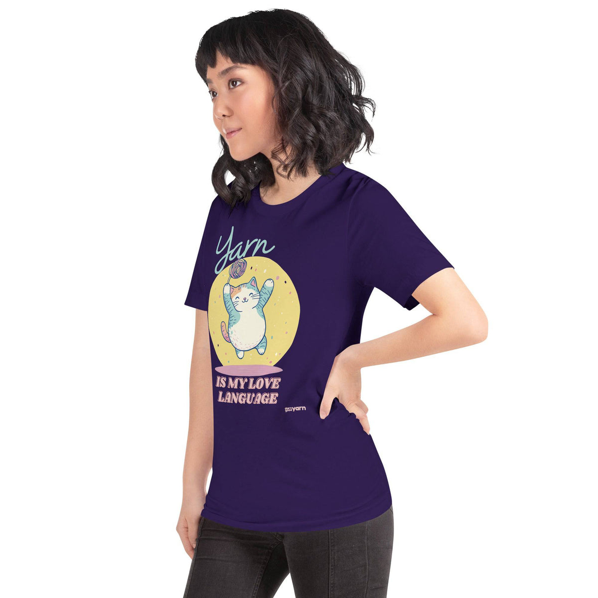 Unisex purple T-shirt from Darn Good Yarn with "Yarn is My Love Language" printed on the front. Casual and comfortable style.