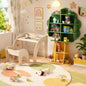 Kids furniture set with a wooden table, chairs, and a tree-shaped bookshelf organizer for children’s play and study areas.