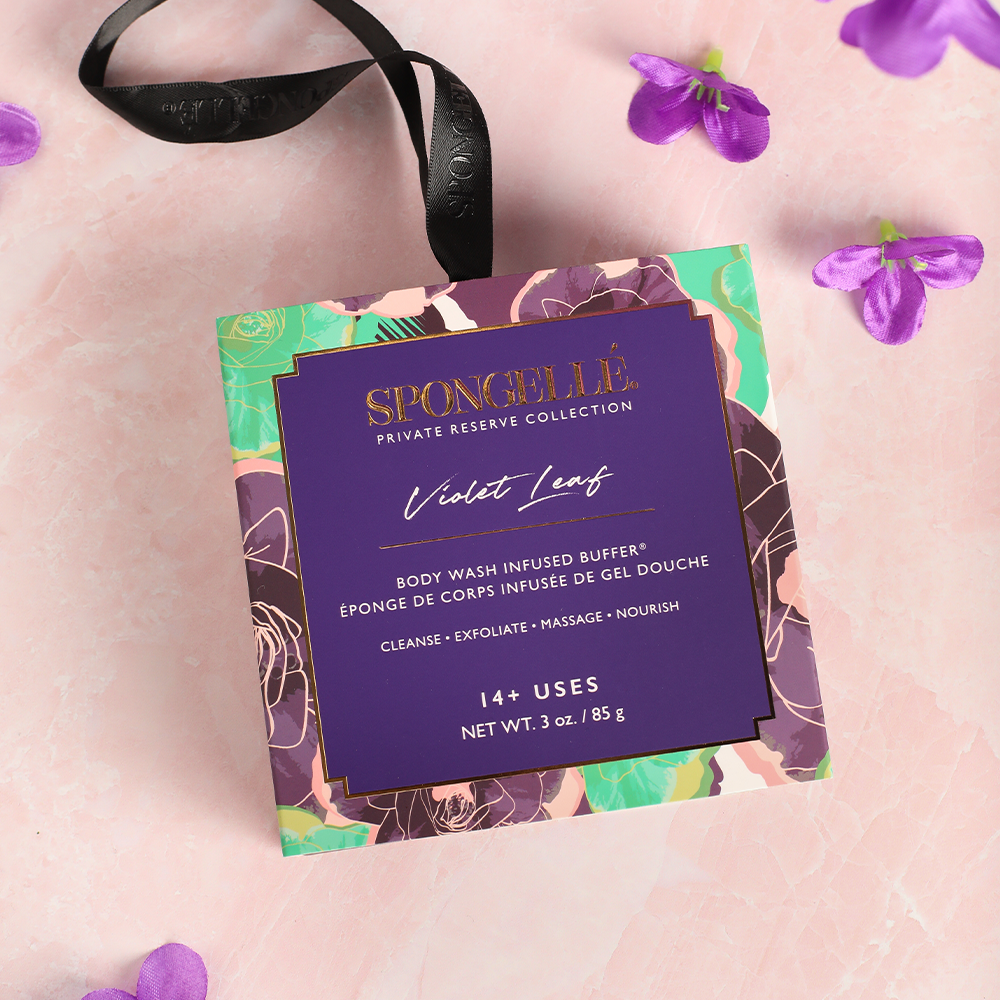 Spongellé Violet Leaf Body Wash Infused Buffer with violet flower design and purple packaging for gentle exfoliation.