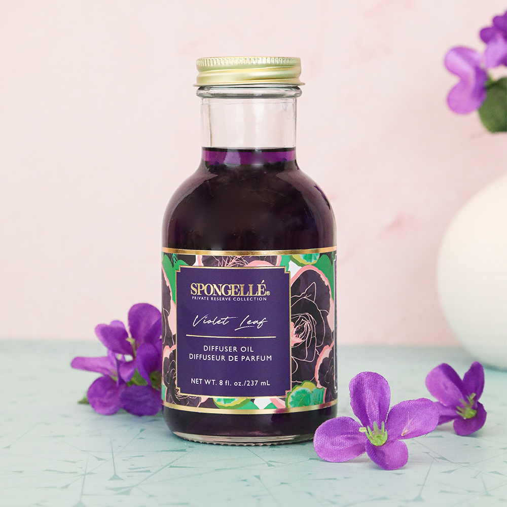 Violet leaf diffuser oil from Spongellé's Private Reserve Collection, featuring a clear bottle with violet leaf fragrance for home use.