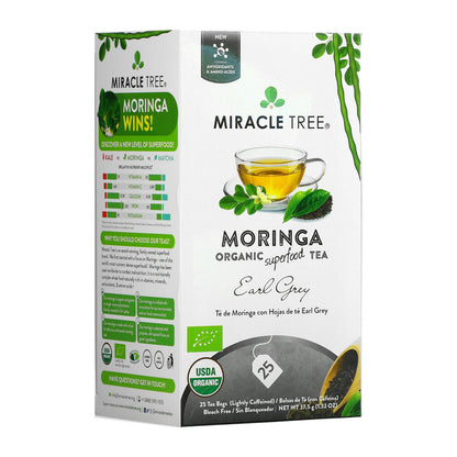Organic Moringa Earl Grey herbal tea by Miracle Tree, featuring dried tea leaves and Moringa herbs in a clear glass cup.