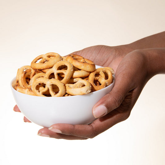 High protein pretzel twists by Biocare, showing golden-brown pretzels twisted in a classic shape on a neutral background.