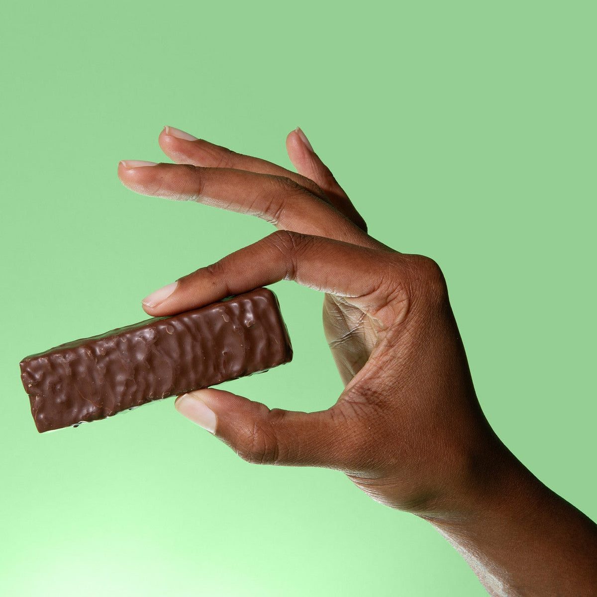 Biocare 15G Protein Minty Cocoa Crunch Bar showing the chocolate and mint-flavored protein bar with crunchy texture.