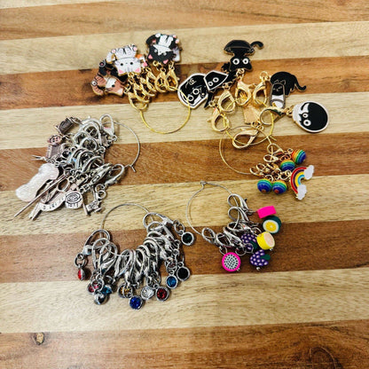 Whimsical Darn Good Yarn mystery stitch marker set with eco-friendly yarn, perfect for crochet and knitting projects.