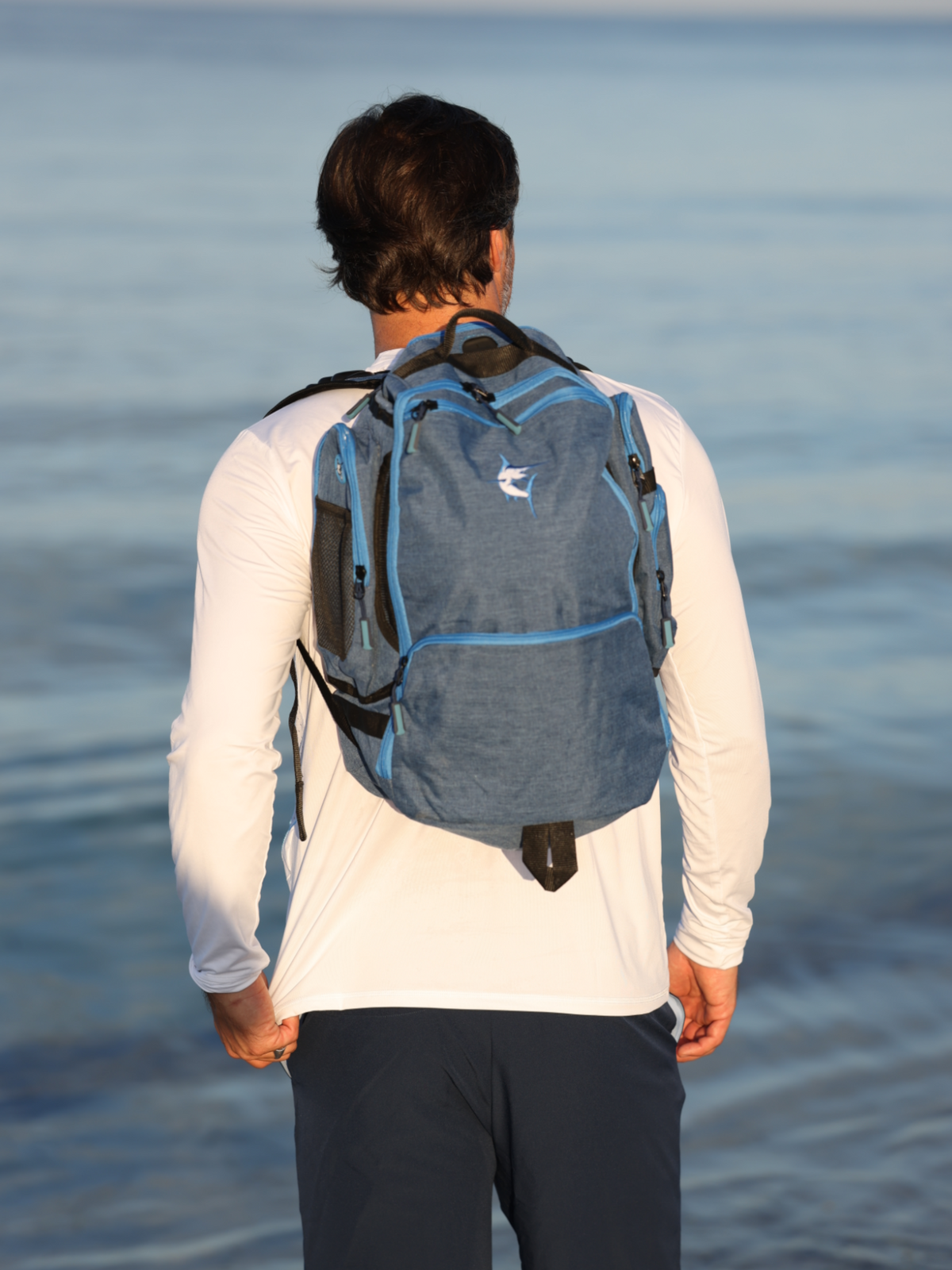 Simple white water life day trip backpack with adjustable straps and multiple compartments, suitable for outdoor adventures.