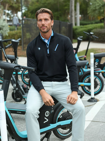 Black Oceanside Pullover by White Water Life, featuring smooth stretch fabric and casual fit, displayed on a mannequin.